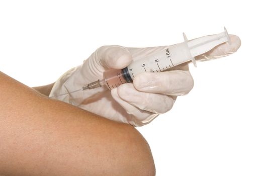 syringe in his hand on a white background