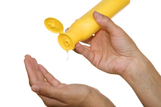 bottle of gel in his hands on a white background