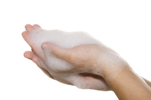 hands on a white background covered with foam