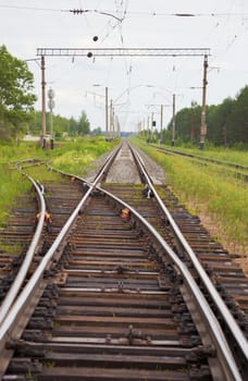 The railway - Switch, rails, sleepers, poles, wires