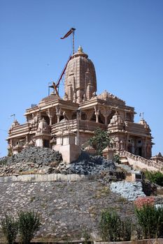 A exterior view of an ancient temple( of Jain religion) with beuatiful artwork, in India.