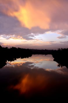 The beautiful colors of sunlight reflected in an Indian river, at dawn.