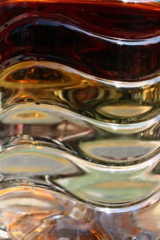 A closeup view of a plastic bottle with wavy patterns.