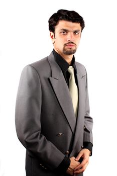 A portrait of a young Indian boss, isolated on a white studio background.