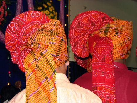 A view of Indian mean wearing traditional colorful turbans.