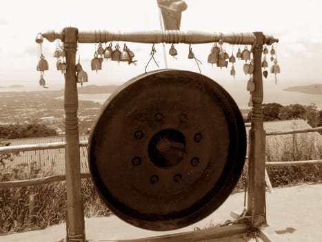 An ancient gong outside a Buddhist temple in Thailand.