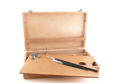 Wooden painter case with brushes on white background.