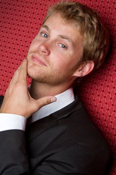 Thinking man wearing black suit