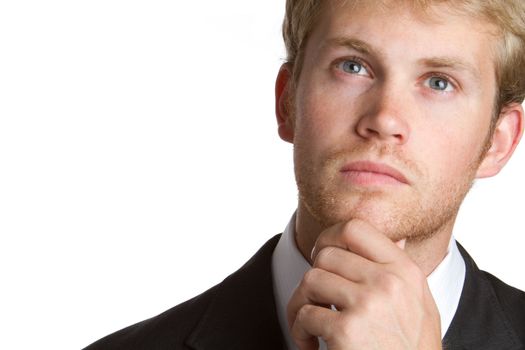 Young businessman thinking portrait closeup