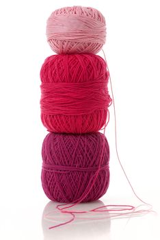 spools of many colors on a white background.