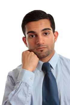 A thinking businessman wearing a blue pinstripe shirt and tie