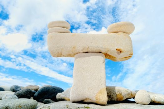 Stack of pebbles against the blue sky