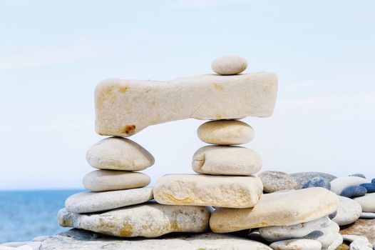 Some small pebbles are connected with a large stone