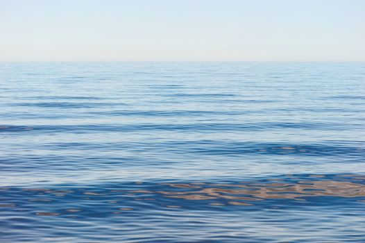Sea surface with small soft waves in morning