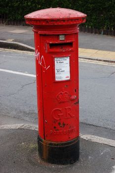 Famous classic red London post office on the street