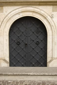 Old steel rounded door in Cracow, Poland