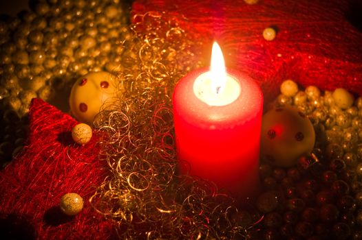 Red candle with christmas decoration