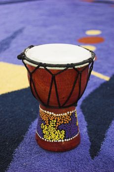 African drum - djembe over blue background