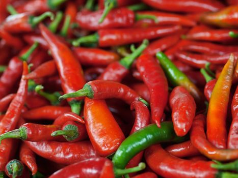 Close up of a pile of red chili peppers in a market in Malaysia