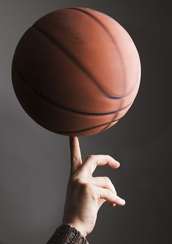 Basket ball rolling on finger by player