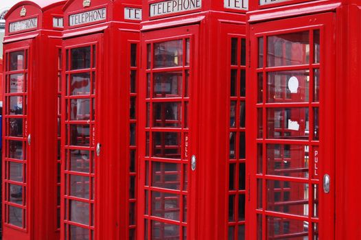 Four classic London telephone cabins. London symbol