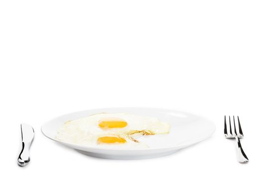 two fried eggs on a plate on white background