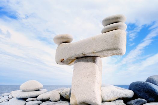 Stack of pebbles against the blue sky