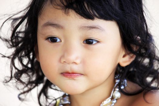 Portrait of the beautiful small Asian girl. Indonesia. Java