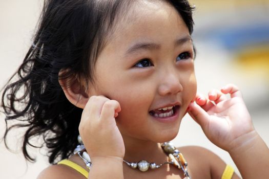 Portrait of the beautiful small Asian girl. Indonesia. Java