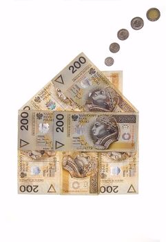 Real estate concept - House made of polish zlotys isolated