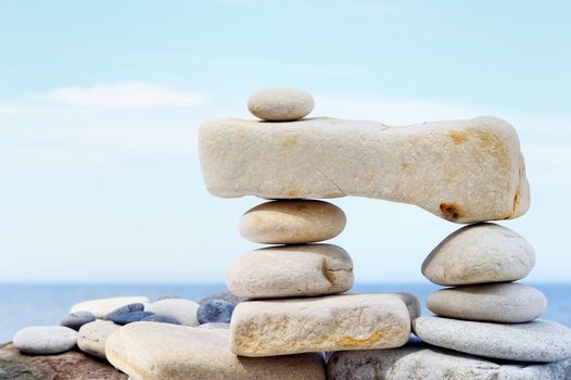 Some small pebbles are connected with a large stone