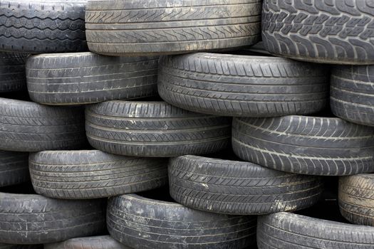 Heap of old tires arranged with neat. 