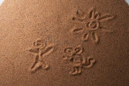 Red sand with trace showing a child, dog, and sun