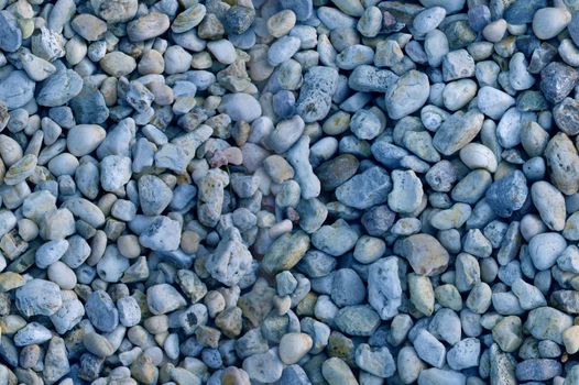 Seamless image of smooth decorative blue pebbles Could be used as texture