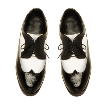 Two-tone black and white patent leather men's shoes on white