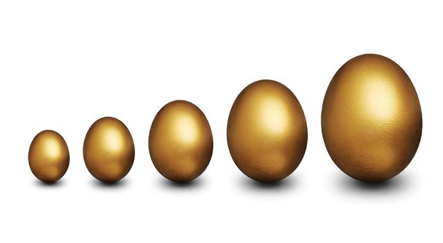 Five golden egg of various sizes representing financial security against a white background
