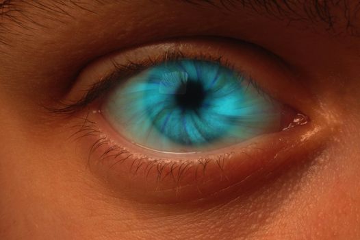 Close-up of eyeball with a blue vortex