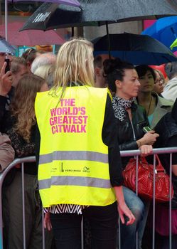 COPENHAGEN - AUGUST 14 : Security on guard at the longest ever catwalk during the Copenhagen Fashion Week. 220 models joins the mile long catwalk on August 14, 2010 in Copenhagen, Denmark. 
