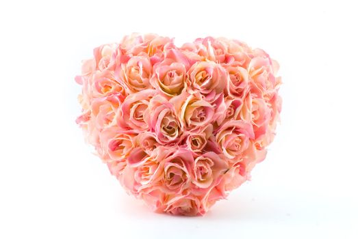 pink artificial roses heart isolated on white