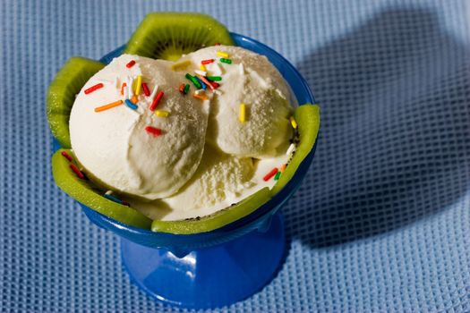 Close up of vanilla ice cream with kiwi