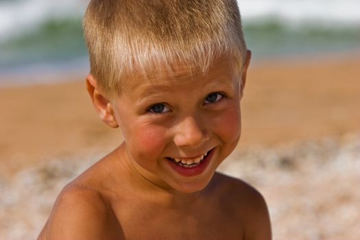 portrait series: a summer cheerful boy smiling