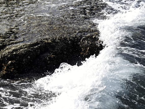 Typical rocky coastline in Malta, during rough seas