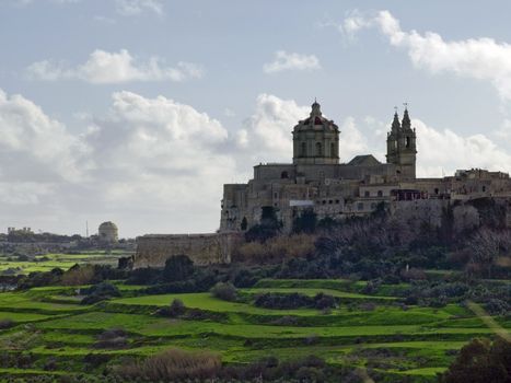 The dome of the medieval cathedral overlooking the bastions of the old city of Malta, Mdina.