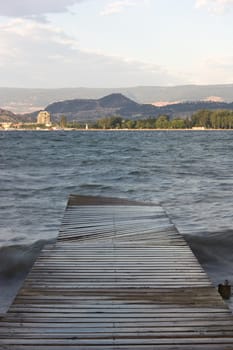 vertical footbridge, lake and mountains view
