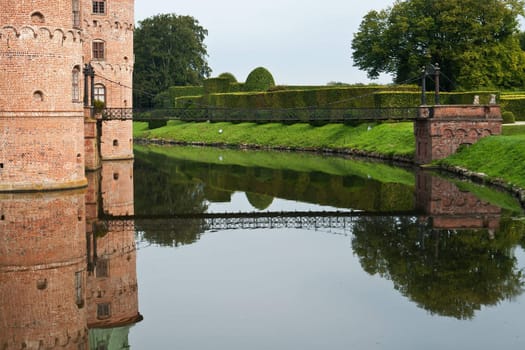Egeskov castle slot landmark fairy tale castle in Funen Denmark view from the back bridge