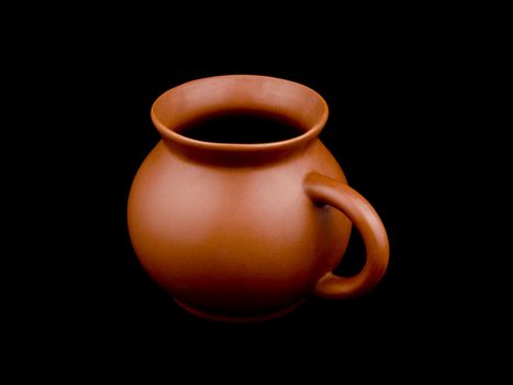 Ceramic cup on black background