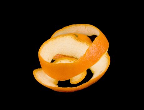 Orange peel on black background