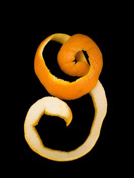 Orange peel on black background