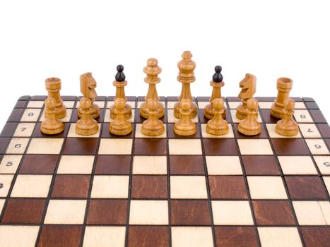 White chess-man standing at chessboard on white background