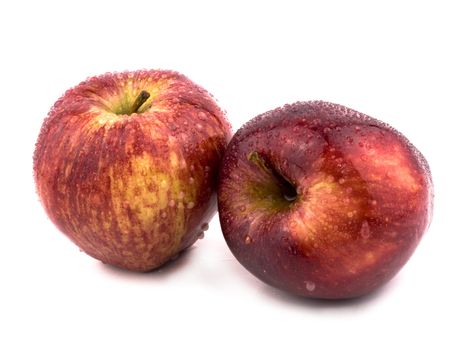 Two tasty red apples on white background